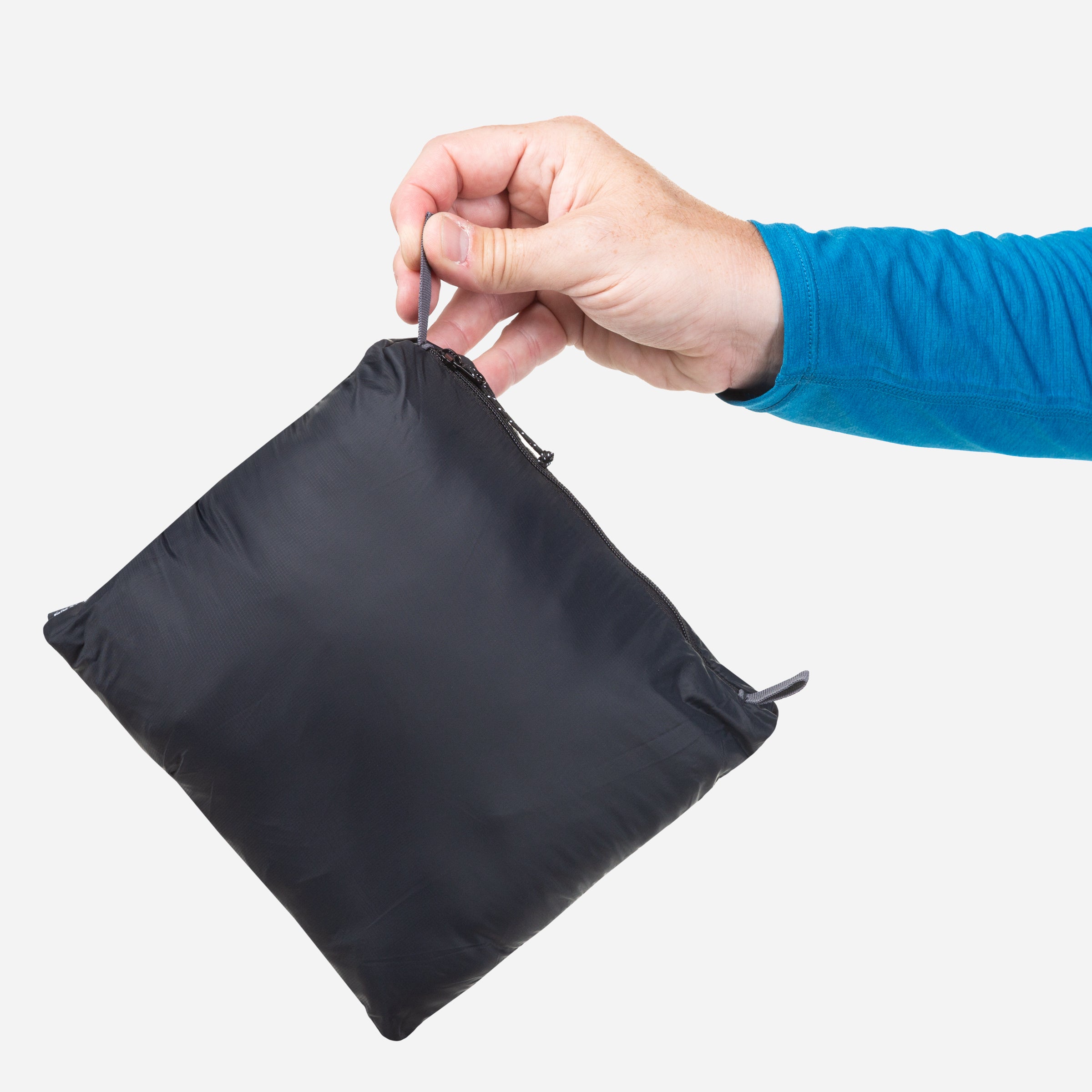 detail::Packs into rear pocket with twin karabiner carry loops